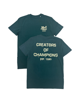 A green t-shirt with 'CREATORS OF CHAMPIONS' text and the year '1985' on it, displayed in two different views.