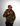 Person wearing a Creators of Champions Hoodie camouflage hoodie with a logo on a gray background