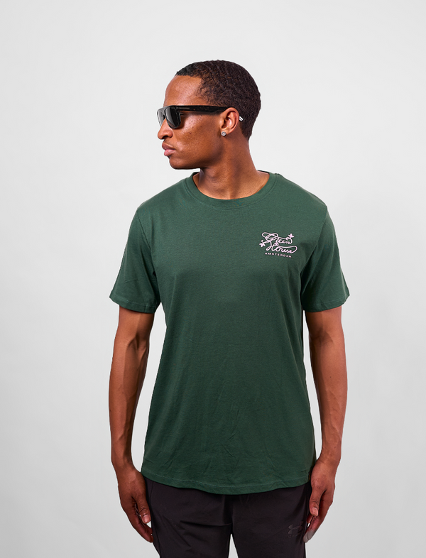 Man wearing a green t-shirt with A Greenhouse Amsterdam logo 