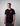 Man wearing a Creators of Champions T-shirt White Widow with a logo on a gray background
