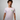 Man wearing a Creators of Champions T-shirt chemical Bride with a green logo on a gray background