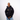 Person wearing a black Green House X Patta hoodie with logos on a white background