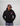 Man wearing a black GH Creators Of Champions Black Pink Hoodie
 hoodie with a logo on a gray background