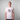 Man wearing a white Greenhouse Amsterdam t-shirt with text on a gray background