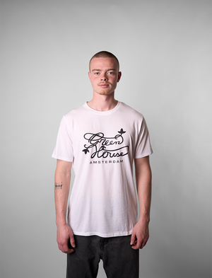 Man wearing a white Greenhouse Amsterdam t-shirt with text on a gray background