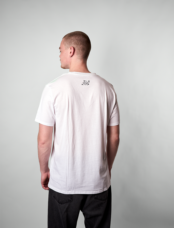 Man wearing a white t-shirt with a logo on the back against a plain background