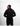 Person wearing a black hoodie and pants on a white background