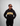 Person wearing a black hoodie with 'Greenhouse Coffee' text on a gray background