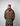 Man wearing a camouflage STRAIN HUNTERS hoodie 