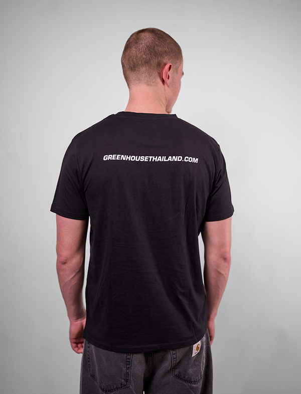 Man wearing a black t-shirt with 'GREENHOUSETHAILAND.COM' text on the back against a gray background